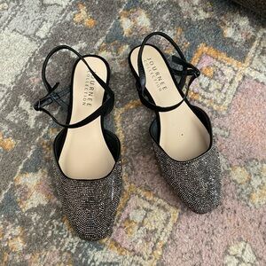 Lightly worn black and silver flat